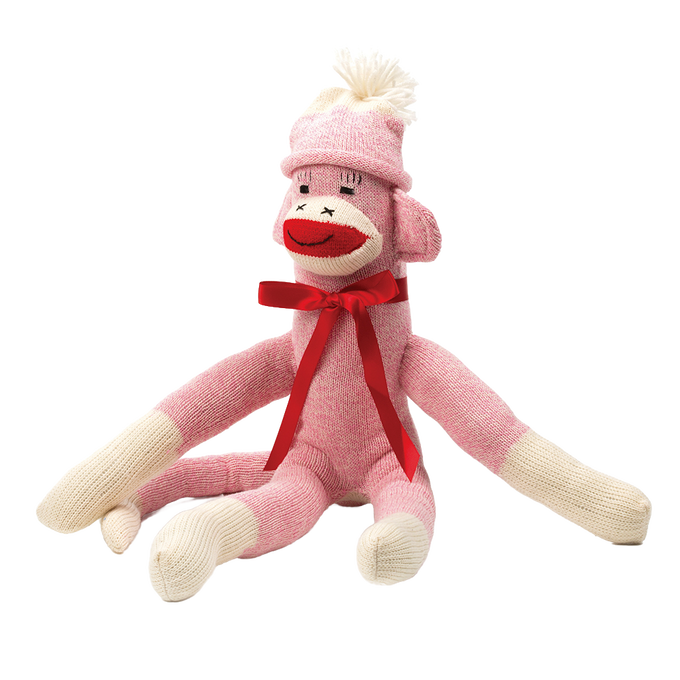 Handcrafted pink and cream knit sock monkey with a white pom-pom hat and red ribbon bow, made in USA, featured in Toys, Books & Games, USA Made, Children's Toys, Indoor Play, and Best Sellers collections.