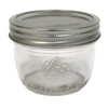 Clear glass wide mouth half-pint canning jar with silver metal lid, handcrafted and made in USA, perfect for food preservation, kitchen use, and crafts.