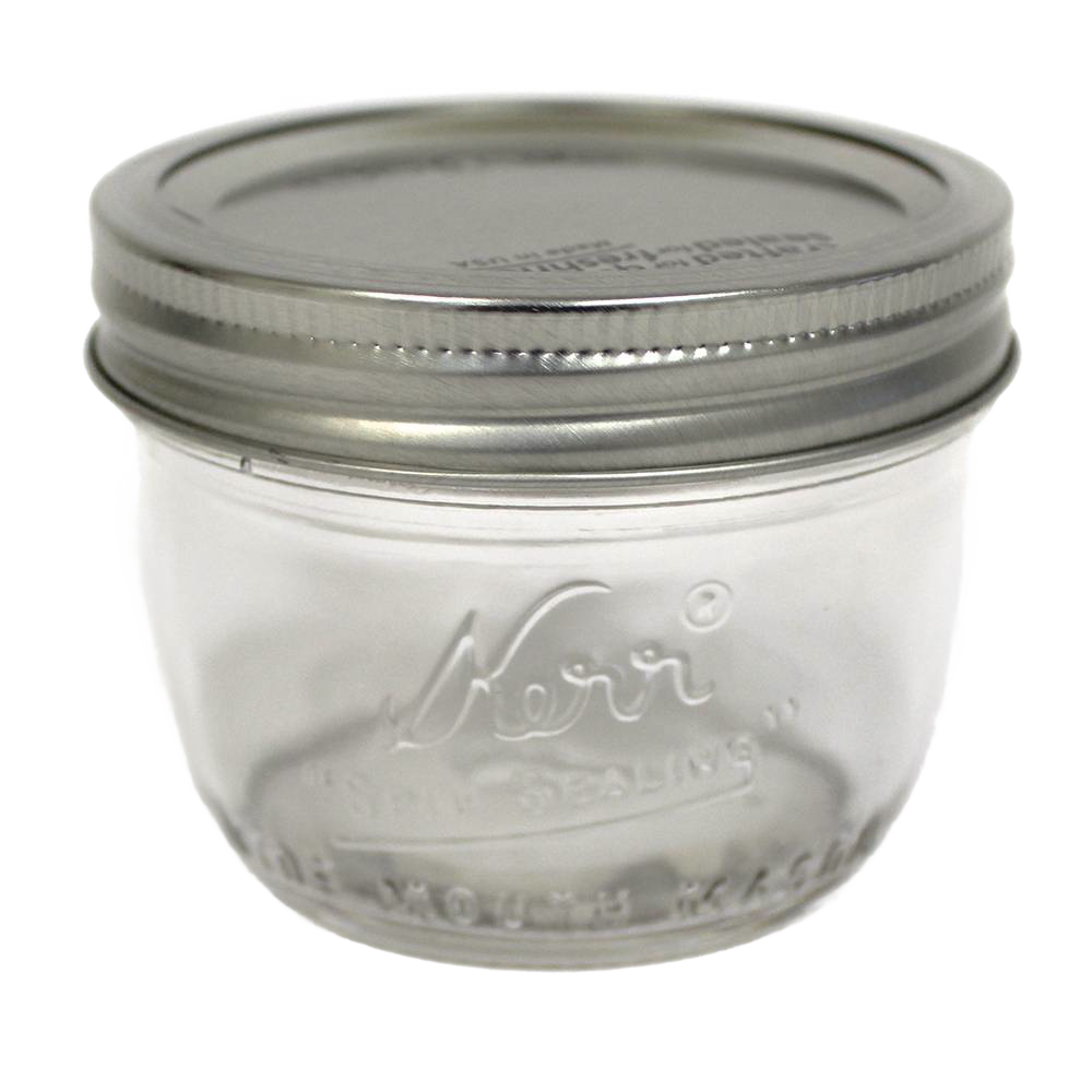 Clear glass wide mouth half-pint canning jar with silver metal lid, handcrafted and made in USA, perfect for food preservation, kitchen use, and crafts.
