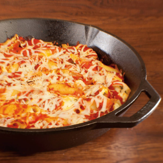 Handcrafted Lodge Classic Cast Iron Skillet filled with baked pasta topped with melted cheese, demonstrating excellent heat retention and durability for Kitchen & Food, Cookware, Cast Iron, Best Sellers, Promo Eligible collections.