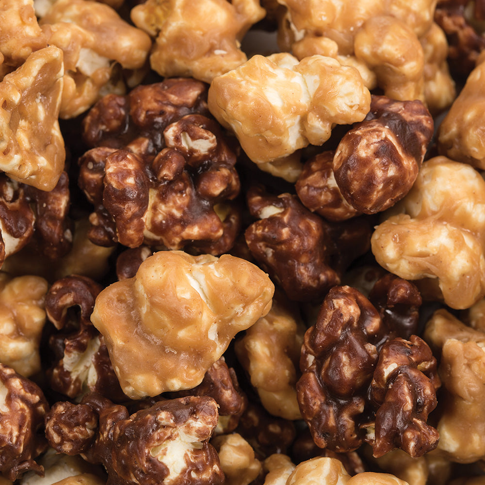 Close-up of hand-popped popcorn in sweet and savory flavors, showcasing a mix of golden caramel and rich chocolate coatings, made in USA, featured in Kitchen & Food, Snacks and Sweets, and Best Sellers collections.