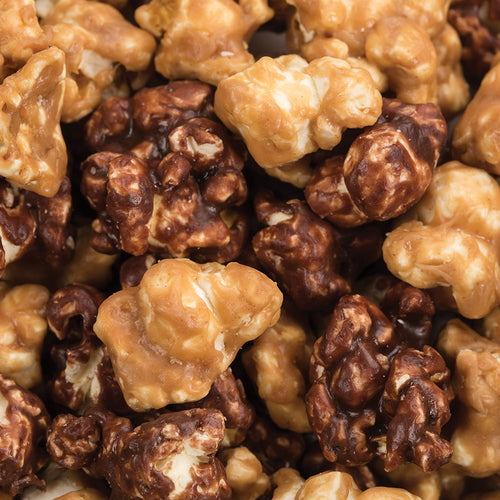Close-up of hand-popped popcorn in sweet and savory flavors, showcasing a mix of golden caramel and rich chocolate coatings, made in USA, featured in Kitchen & Food, Snacks and Sweets, and Best Sellers collections.