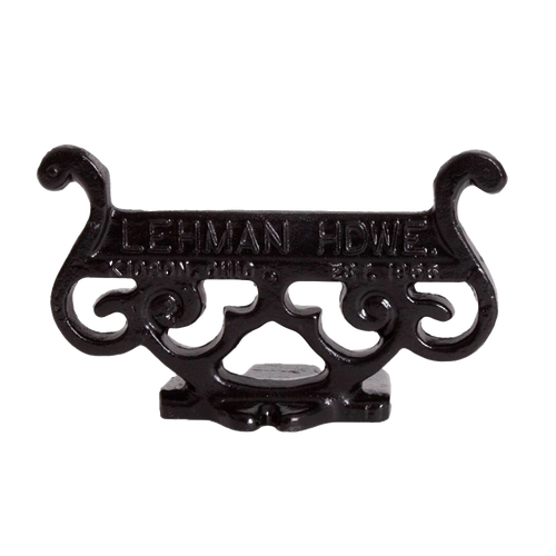 Glossy black cast aluminum boot scraper with intricate vintage scroll design, handcrafted by Amish artisans, ideal for Home & Decor, USA Made, and Best Sellers collections.