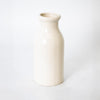 Handmade cream-colored stoneware milk bottle crafted in the USA, perfect for farmhouse-style kitchen decor, storage, and serving in Home & Decor collections.