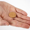 Hand holding a small round cork seal gasket designed for fuel caps, featured in lamps & lighting, parts and accessories, other parts, best sellers, and promo eligible collections.