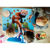 Children and an adult assembling a uniquely shaped red panda puzzle with large pieces on a blue table, surrounded by a snack bowl and educational booklet, part of toys and games collections.