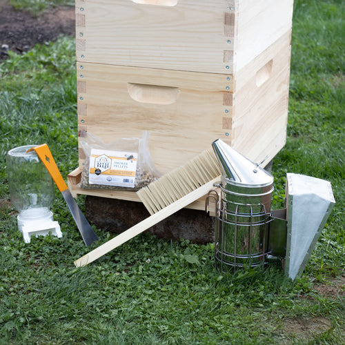 Handcrafted natural wood 8-frame beehive kit with smoker, bee brush, hive tool, and smoker pellets arranged on grass, ideal for Farm, Garden & Tool and Beekeeping Supplies collections.