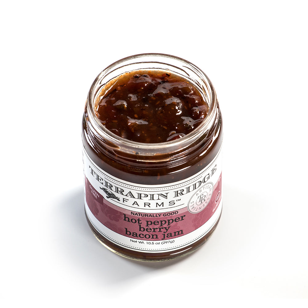Open jar of handcrafted hot pepper berry bacon jam with visible textured chunks, presented against a white background, perfect for Kitchen & Food and Pantry collections.