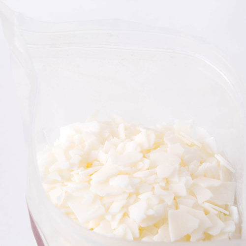 Close-up of handcrafted all-natural white soy wax pellets in a clear resealable bag, featured in Lamps & Lighting, Candles and Candlemaking, Candlemaking Supplies, Best Sellers, and Promo Eligible collections.