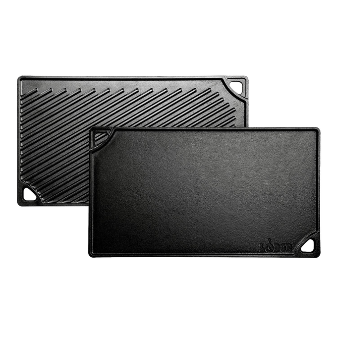 Reversible black cast iron griddle with a smooth flat side and a ribbed grill surface, featuring corner handles and durable construction, handcrafted in the USA, ideal for Kitchen & Food and Cast Iron cookware collections.