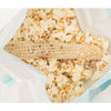Popped popcorn surrounding a fully popped empty cob inside a microwave bag, highlighting a wholesome snack made in USA, ideal for Kitchen & Food, Snacks, Popcorn, and Best Sellers collections.