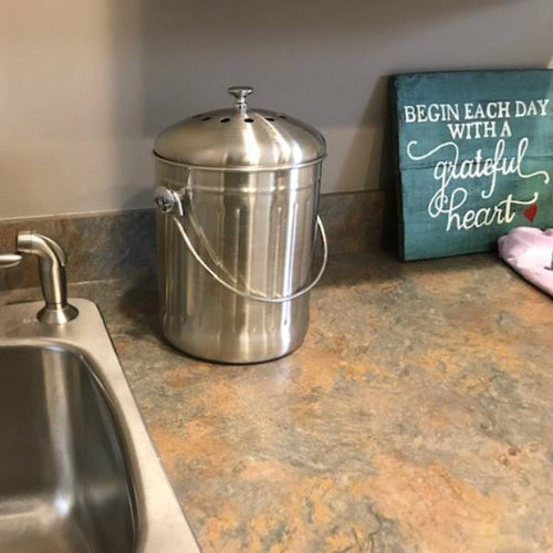 Brushed stainless steel compost pail with vented lid and sturdy handle, designed for odor-free countertop use in Farm, Garden & Tool and Kitchen & Food collections, featuring a handcrafted design.