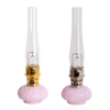 Pair of limited edition vintage-style oil lamps with delicate pink Tuscan glass bases, tall clear chimneys, featuring handcrafted metal hardware, ideal for Lamps & Lighting collections.