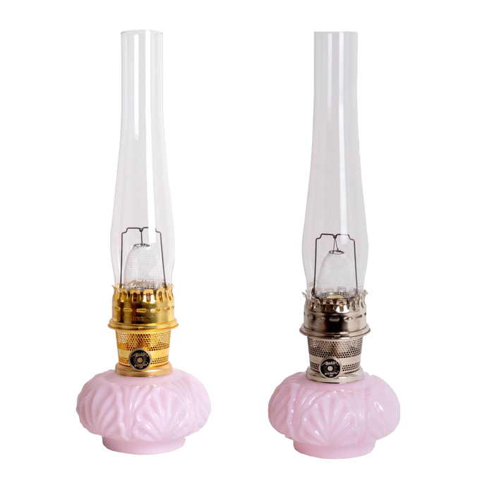 Pair of limited edition vintage-style oil lamps with delicate pink Tuscan glass bases, tall clear chimneys, featuring handcrafted metal hardware, ideal for Lamps & Lighting collections.