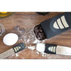Adjustable measuring spoons and scoop with sliding measurement indicators, surrounded by flour, chocolate chips, and an egg, ideal for Kitchen & Food, Food Prep, and Measuring collections.