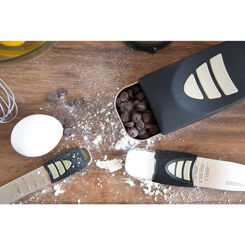 Adjustable measuring spoons and scoop with sliding measurement indicators, surrounded by flour, chocolate chips, and an egg, ideal for Kitchen & Food, Food Prep, and Measuring collections.