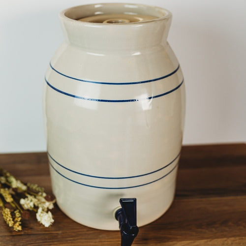Handcrafted stoneware water cooler with subtle blue stripes and black spigot, made in USA, ideal for Kitchen & Food, Storage and Serving, Best Sellers, and Promo Eligible collections.