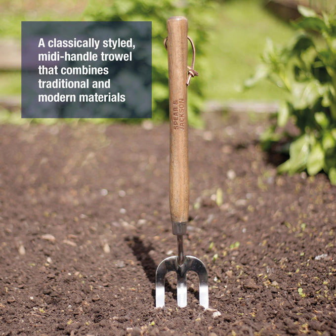 Hand tool with polished stainless steel tines and smooth wooden handle, designed for durable garden use in farm, lawncare, and digging collections.