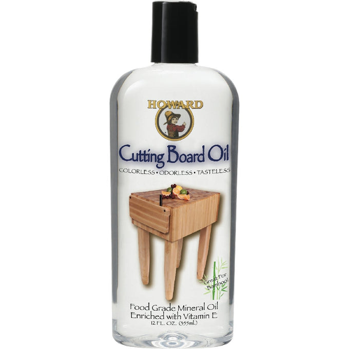 Clear bottle of food-grade mineral oil with black cap labeled for conditioning and seasoning wooden surfaces, shown with a small wooden chopping block, ideal for Kitchen & Food and Food Prep collections.