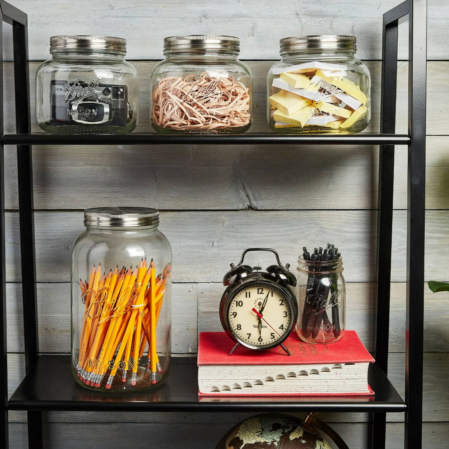 Handcrafted decorative storage jars with stainless steel lids holding office supplies and craft materials, styled on a black metal shelf for Home & Decor, Kitchen & Food, and Household Helpers collections.