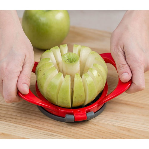 Red hard plastic apple slicer with stainless steel blades cutting a green apple into sixteen thin, uniform wedges and removing the core, featured in Kitchen Gadgets and Apple Harvest Supplies collections.