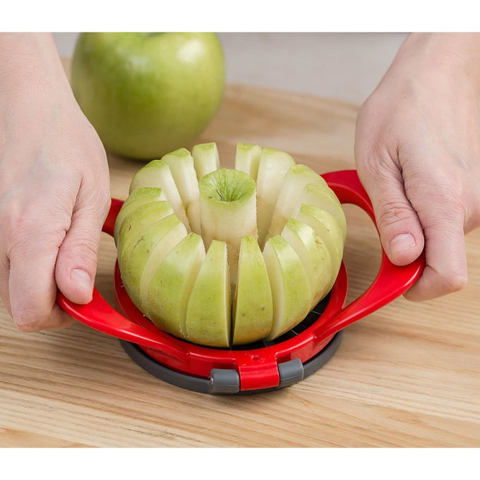 Red hard plastic apple slicer with stainless steel blades cutting a green apple into sixteen thin, uniform wedges and removing the core, featured in Kitchen Gadgets and Apple Harvest Supplies collections.