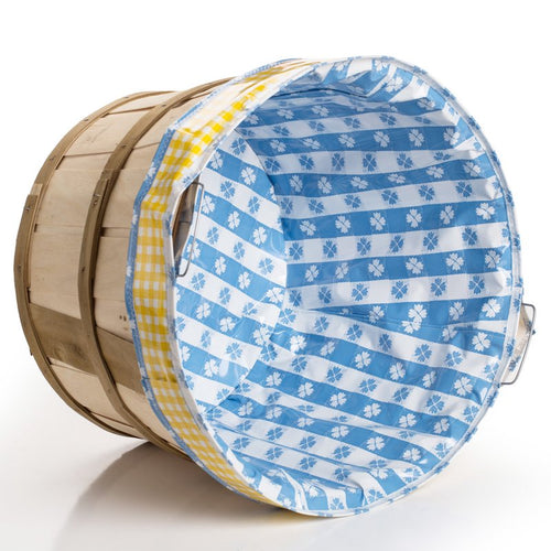 Reusable fabric liner with blue and white floral and stripe pattern and yellow gingham trim, designed for use with bushel baskets to protect laundry and prevent snags, ideal for Home & Decor and Laundry Supplies collections.