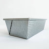Corrugated aluminized steel loaf pan with nonstick surface, handcrafted in the USA, ideal for even baking, featured in Kitchen & Food, Baking Supplies, and Best Sellers collections.