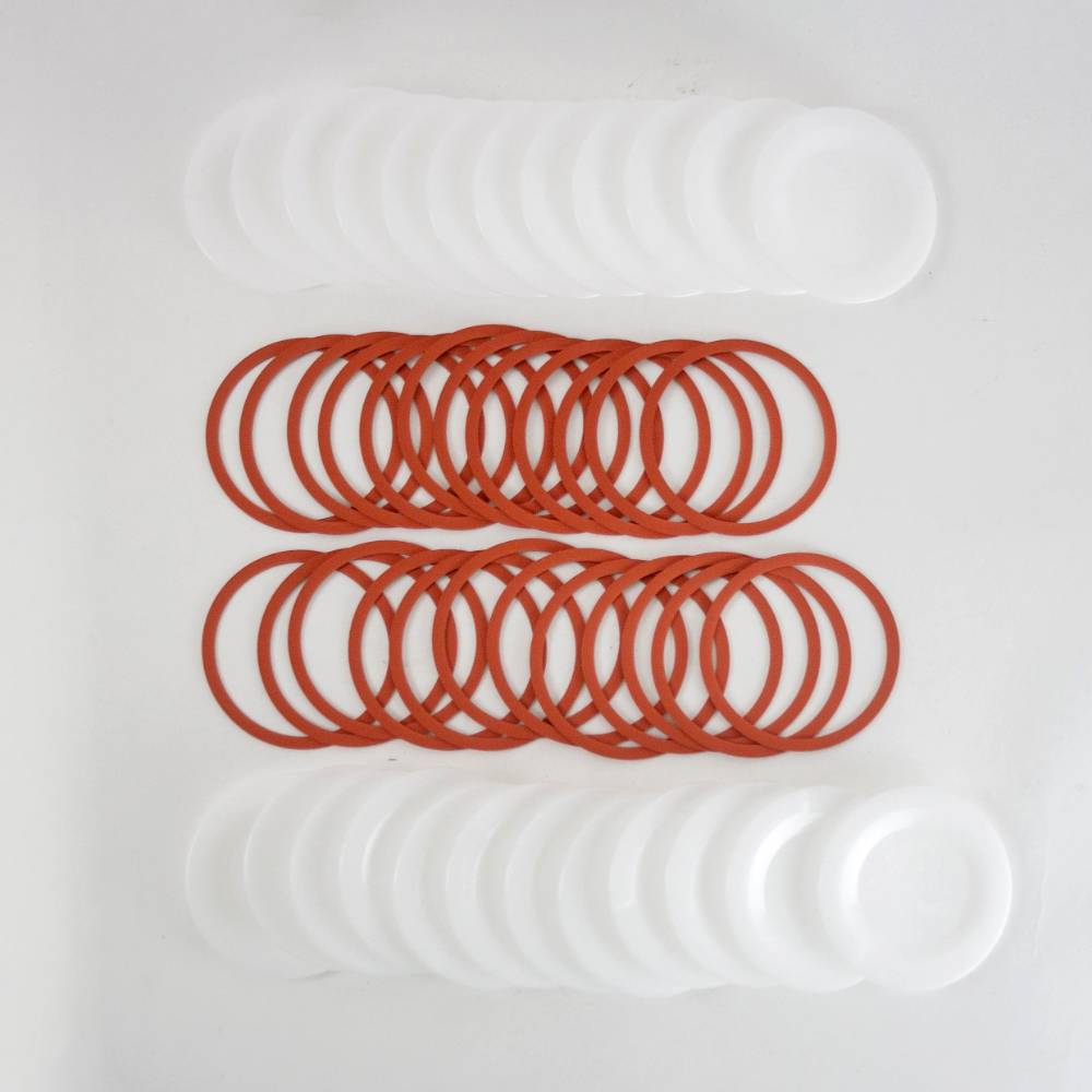 Sets of translucent wide-mouth reusable plastic canning lids with matching orange rubber sealing rings, made in USA for Kitchen & Food, Food Preservation, Canning, and Best Sellers collections.
