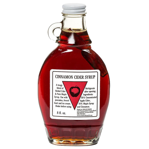 Glass bottle of handcrafted cinnamon cider syrup with a cinnamon stick inside, made in USA, ideal for kitchen, pantry, and apple harvest supplies collections.