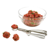 Stainless steel scoop with spring handle beside glass bowl of seasoned ground meat and two uniform meatballs, ideal for Kitchen & Food, Cookware, Baking Supplies, and Kitchen Gadgets collections.