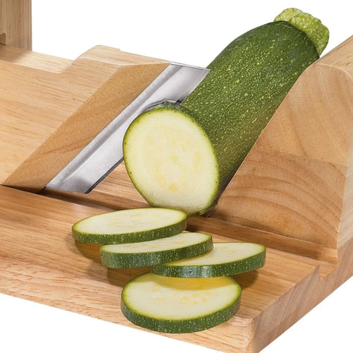 Handcrafted wooden gourmet charcuterie slicer with adjustable sharp blade slicing fresh green zucchini, designed for Kitchen & Food, Food Prep, Choppers and Cutters collections.