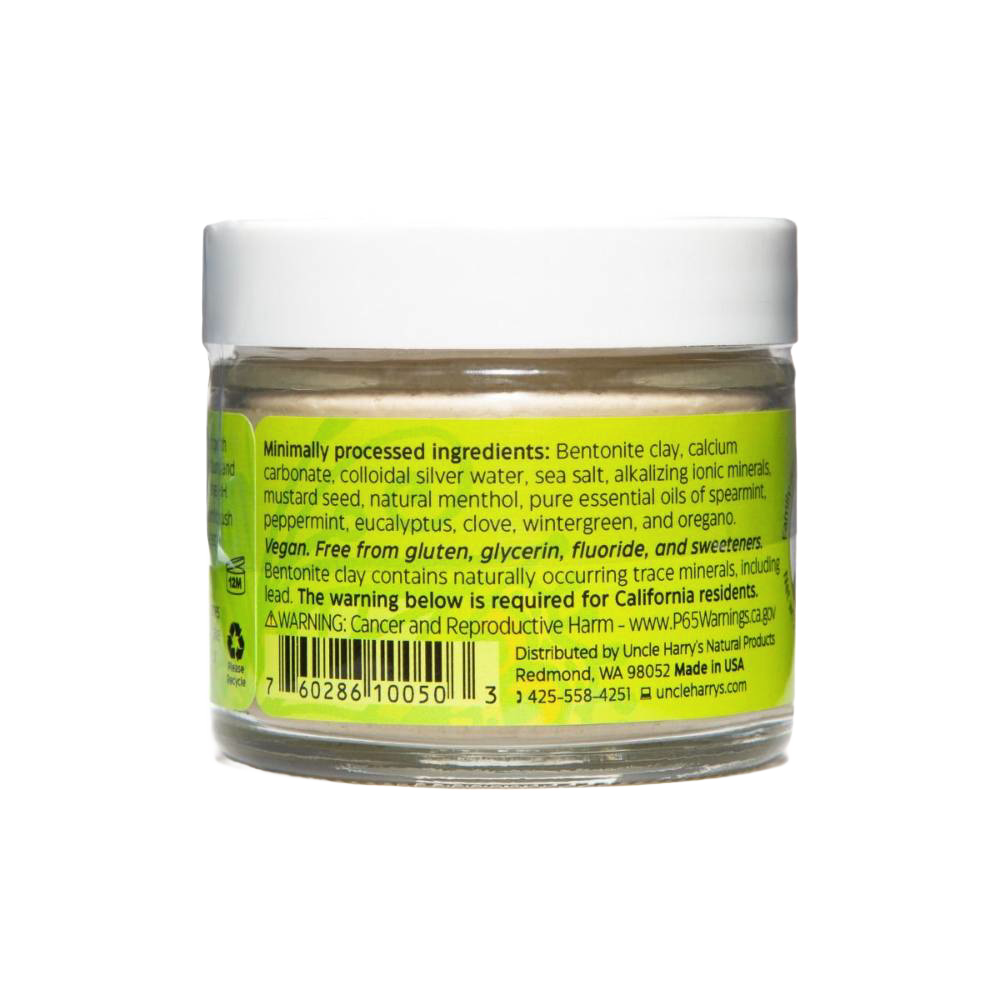 Clear small glass jar with white lid containing handcrafted Uncle Harry’s all-natural alkalizing toothpaste featuring a bright yellow-green label listing natural ingredients, promoting Health & Wellness, Grooming and Personal Hygiene, USA Made, Best Sellers, and Promo Eligible collections.