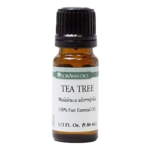 Amber glass bottle with black cap containing handcrafted Tea Tree essential oil, 100% pure and ideal for Health & Wellness, soapmaking, and candlemaking uses.