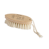 Handcrafted dry massage brush with natural bristles and wooden handle featuring a rope strap, designed to gently exfoliate and stimulate circulation before showering, ideal for Health & Wellness and Grooming collections.