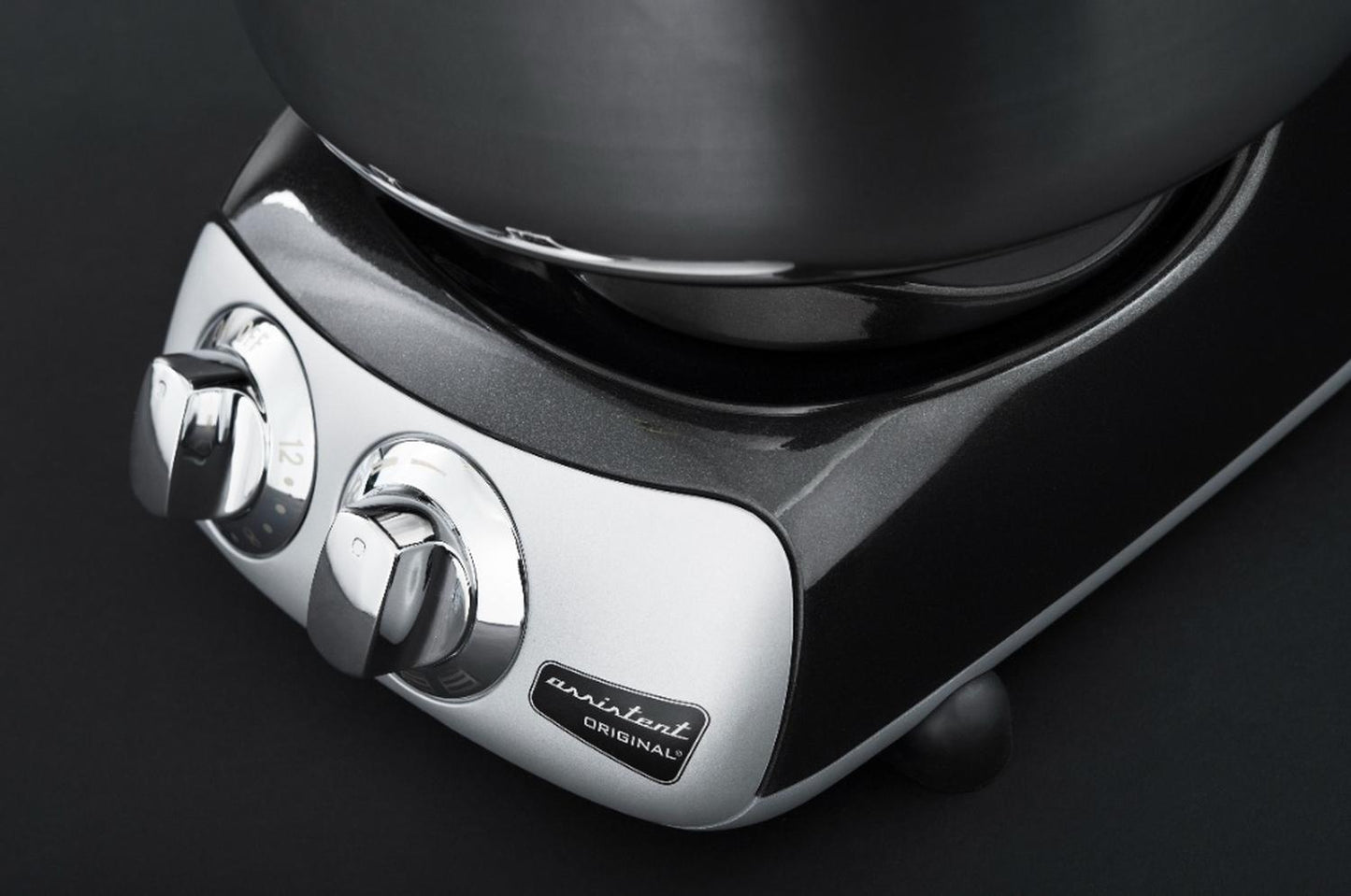 Close-up of a sleek metallic control panel with dual chrome dials on a high-performance mixer base, designed for Kitchen & Food, Baking Supplies, and Kitchen Gadgets collections.