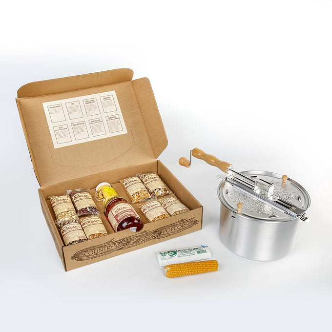 Complete Amish Country popcorn gift set featuring a stainless steel stovetop popper with wooden handle, assorted popcorn kernels, seasoning, and a corn cob holder, ideal for Kitchen & Food and Snacks and Sweets collections.