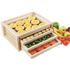 Handcrafted solid oak food drying rack with three fiberglass mesh trays holding sliced oranges, bananas, green peppers, and tomatoes, ideal for kitchen food preservation and drying, made in USA.