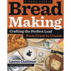Cookbook cover for a bread-making guide with images of fresh bread, a serrated knife, measuring spoons, and herbs, part of books, cookbooks, and best sellers collections.