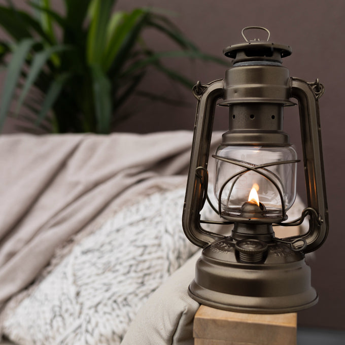 Galvanized oil lantern with heat-resistant SUPRAX globe and protective metal frame, handcrafted for reliable lighting in camping, emergency supplies, and outdoor settings from best sellers collections.