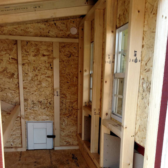 Interior view of a handcrafted Amish made heavy-duty wooden chicken coop with built-in nesting boxes, windows, and a secure side access door, ideal for Farm, Garden & Tool, Chicken Accessories, USA Made, Amish Made, and Best Sellers collections.