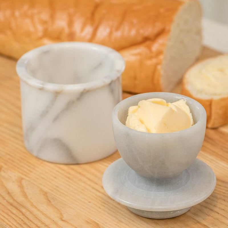 Handcrafted marble butter crock with a smooth bowl and water-sealed base to keep butter fresh up to 30 days, ideal for kitchen, homesteading, and specialty equipment collections.