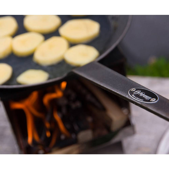 Handcrafted wrought iron pan with a long handle cooking sliced potatoes over an outdoor flame, perfect for Farm, Garden & Tool, Kitchen & Food, Camping, and Cookware collections.