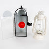 Handcrafted Amish buggy carriage lantern box with hinged clear door and red rear reflector, paired with a white Dietz oil lantern, ideal for lamps, camping, and emergency supplies.