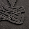 Close-up of a handcrafted cast iron stove door panel featuring detailed embossing of stacked logs, designed for use in stoves, hearth accessories, and heatstoves collections.
