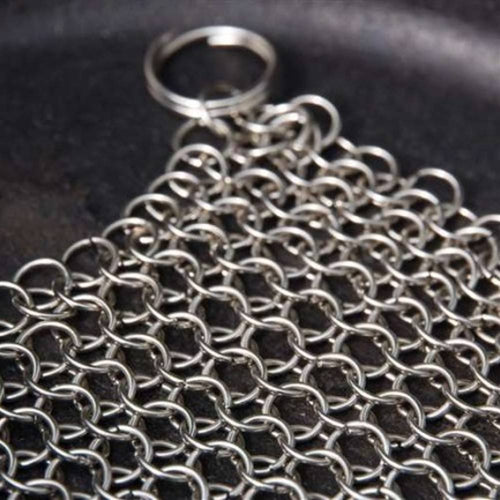 Stainless steel chainmail cleaner with interlocking metal rings and a keyring handle, designed for effortless cleaning of cast and wrought iron cookware, featured in Household Cleaning and Best Sellers collections.