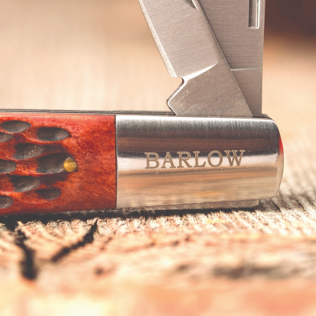Close-up of a handcrafted Old-Fashioned Barlow pocket knife with a polished bone handle and engraved steel bolster, featured in Farm, Garden & Tool and Traditional Pocket Knives collections.