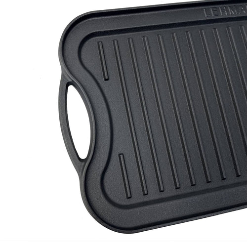 Handcrafted nitrogen-infused cast iron griddle with ribbed grilling surface and ergonomic handle, designed for lasting durability in Kitchen & Food and Cast Iron cookware collections.