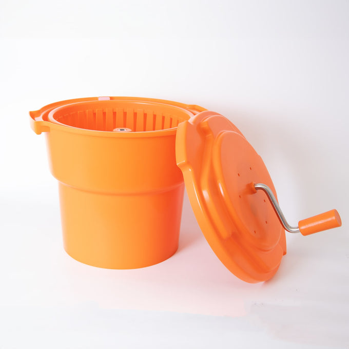 Bright orange hand-powered laundry spinner with a removable lid featuring a crank handle, designed for efficient water removal in laundry tasks, ideal for Home & Decor and Laundry Supplies collections.