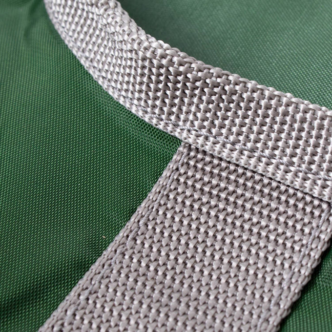 Close-up of a durable woven beige strap attached to a dark green Amish clothespin bag, handcrafted in the USA, ideal for laundry and clothesline use in home and decor collections.